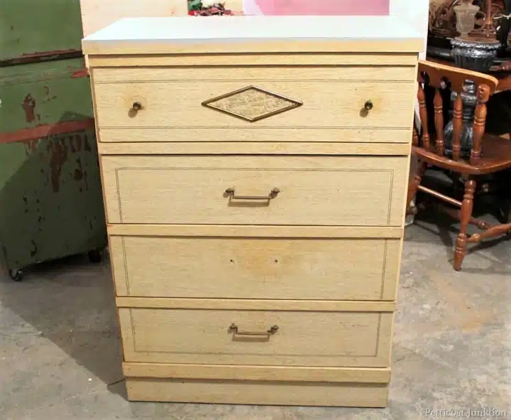 old chest of drawers made of fake wood or MDF wood