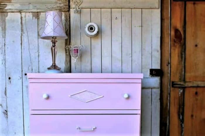 paint old damaged furniture pink and stencil a design to cover the damaged area (3)
