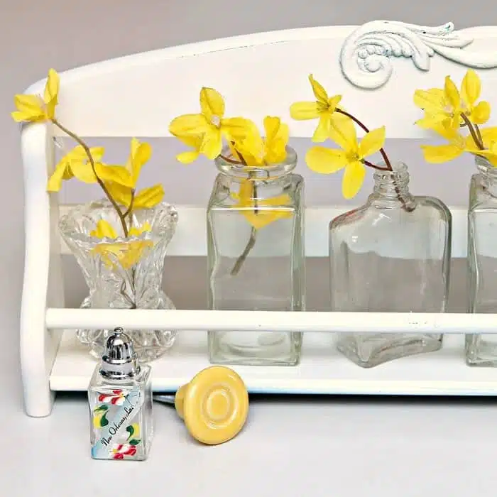 https://petticoatjunktion.com/wp-content/uploads/2018/07/recycle-a-spice-rack-into-a-pretty-flower-display_thumb.jpg.webp