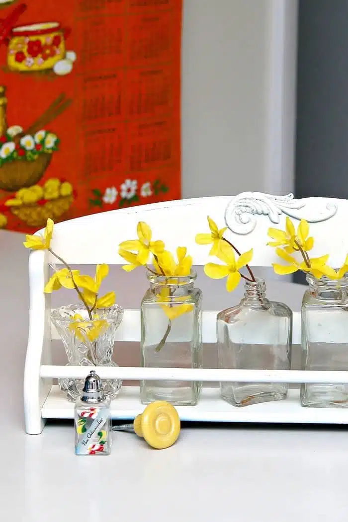 recycled spice rack makes a great flower display