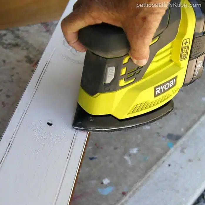 use a battery operated sander to distress paint