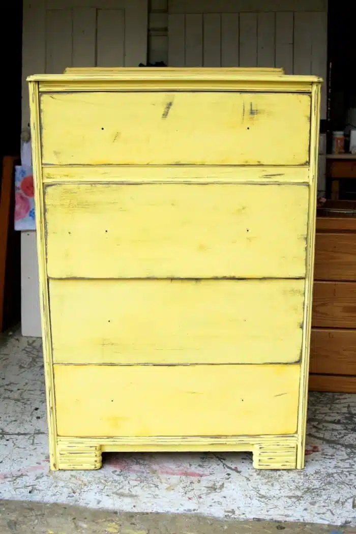 layered paint on furniture in gray and yellow