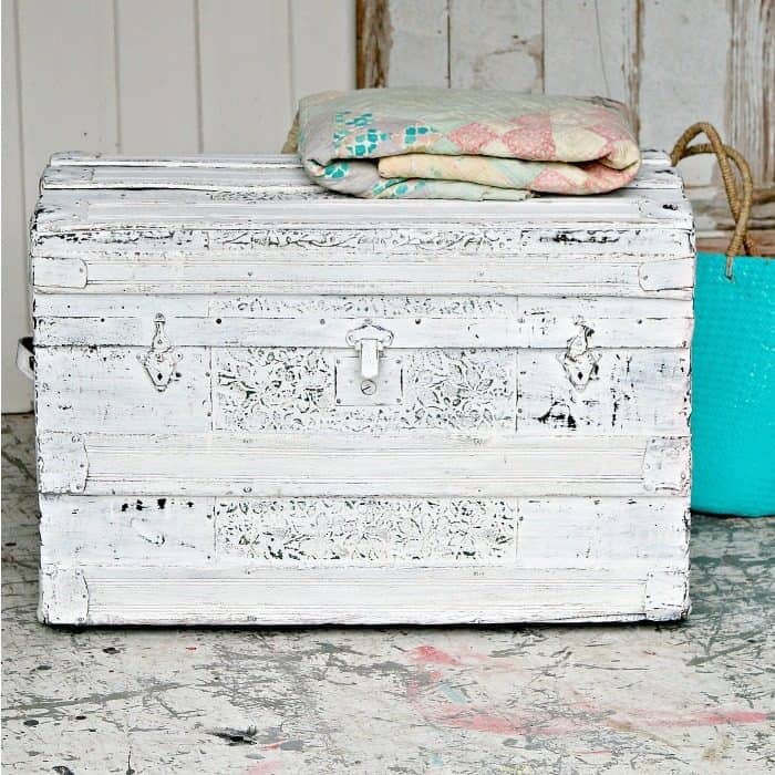 embossed tin trunk painted white and distressed