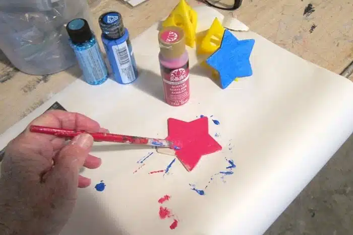 painting a wood star for the tree