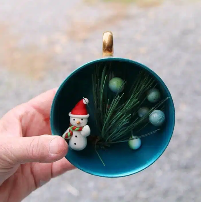 use hot glue to add decor to teacup ornaments
