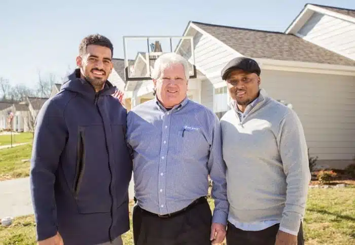 Marcus Mariota, Aarons Rentals, and Warrick Dunn, making a new homeowner very happy with their generosity.