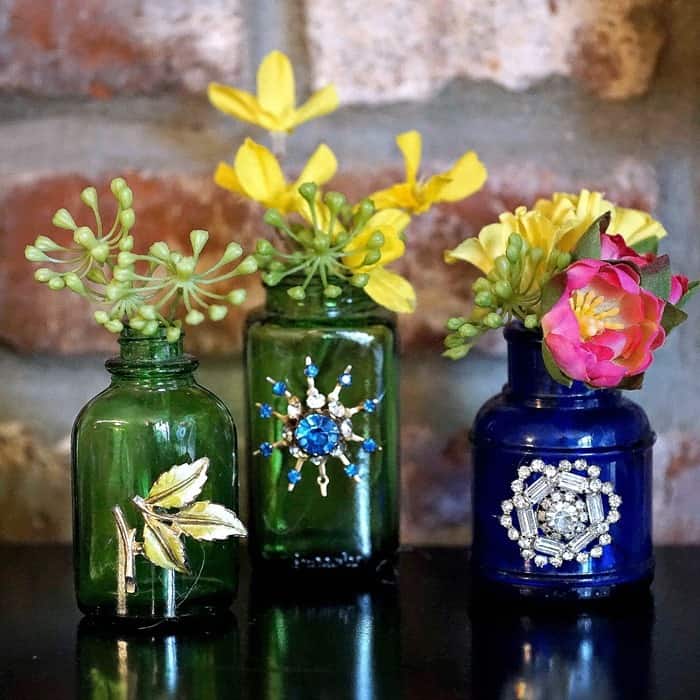 how to make decorative bottle vases by adding jewelry and ribbon