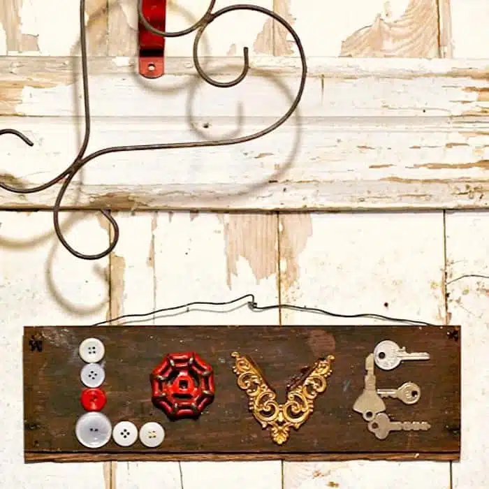 make a wall sign using buttons and hardware