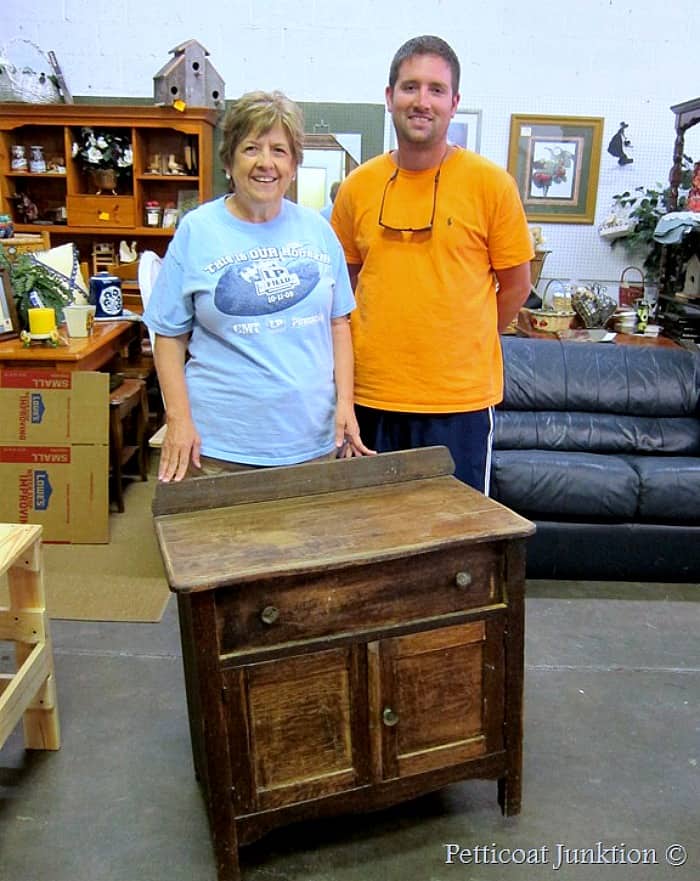 Paula and her son at the furniture workshop