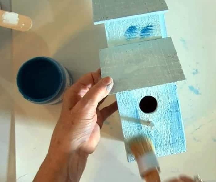 birdhouse with layers of paint