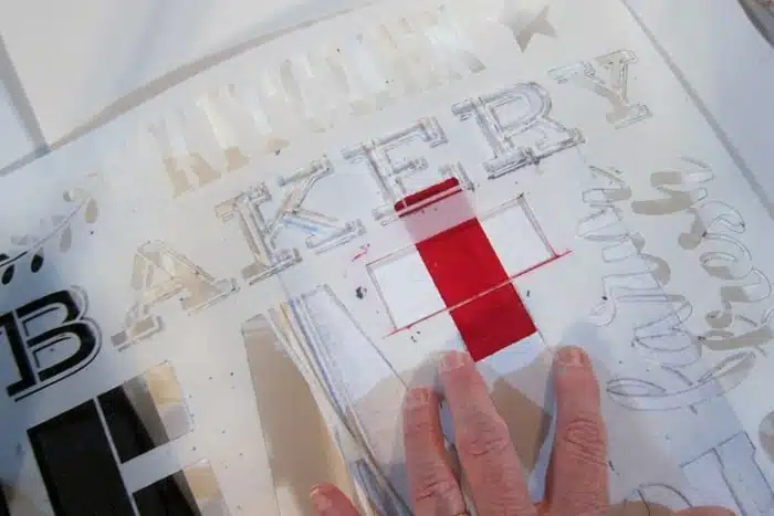 how to stencil a red cross on a book