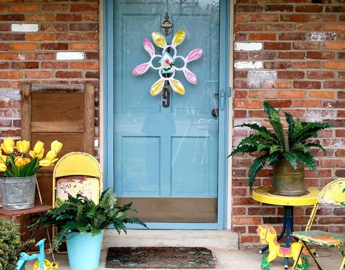 Spring porch decor with yellow tulips and junky treasures