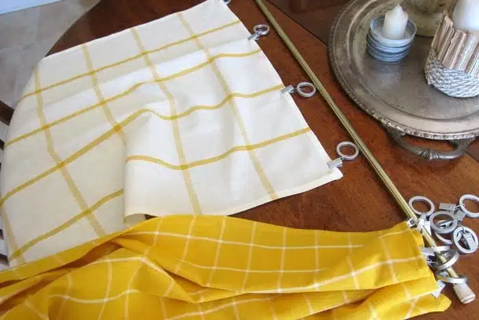 attach dish towels to curtain hooks