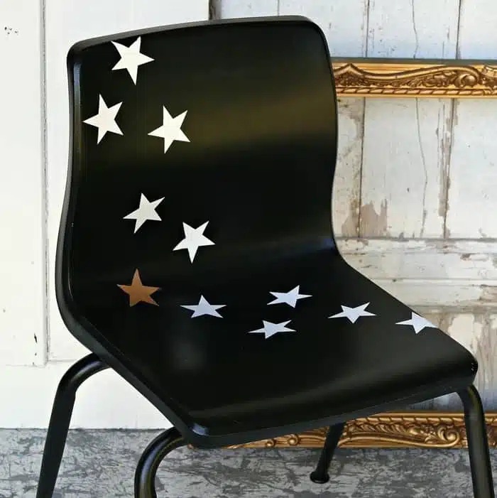black spray paint and star decals make fun furniture