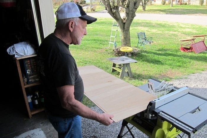 cutting a replacement back for a vintage china cabinet using a Ryobi table saw