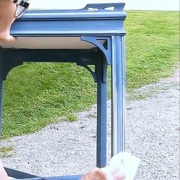 wipe wax onto details on painted furniture