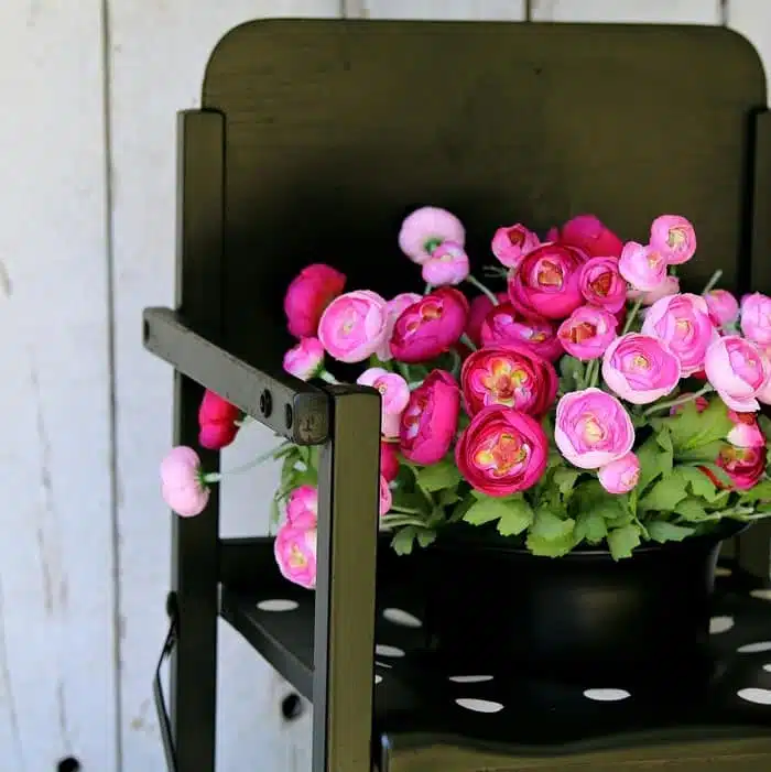 wood potty chair repurposed into a black and white trendy flower planter