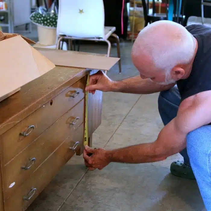 making furniture repairs on a vintage cedar chest