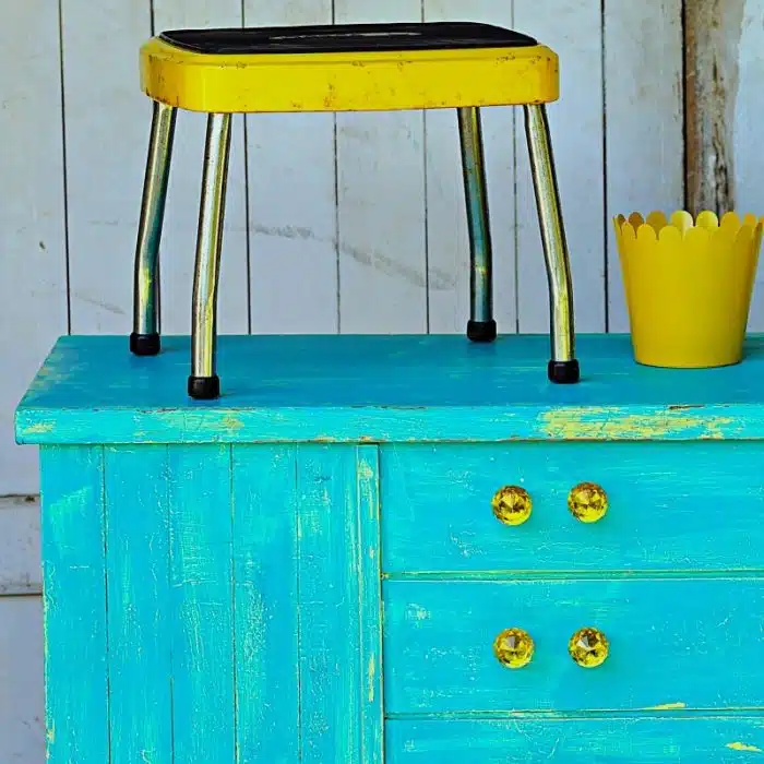 mid century modern cedar chest painted in yellow and turquoise