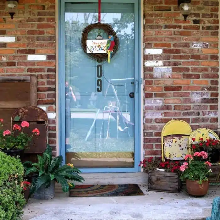 Parrot Head Wreath And Junk Pots Of Geraniums Summer Porch