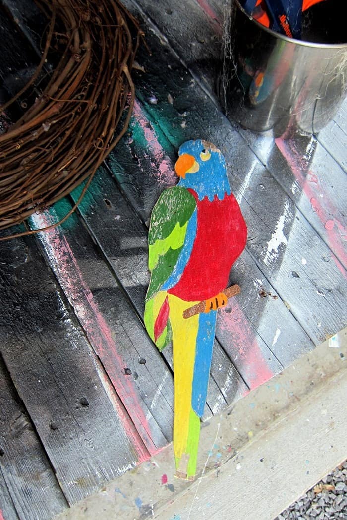 colorful wood parrot recycled from an old sign