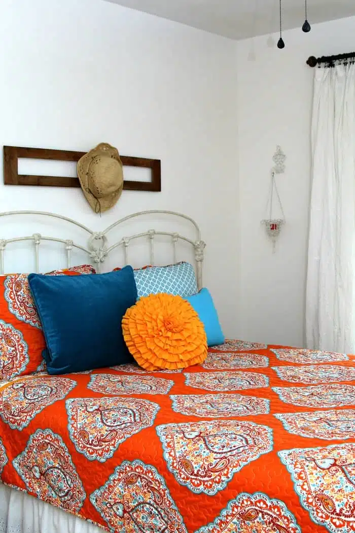 orange and turquoise bedroom makeover with white walls