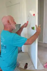 use painters tape around door knobs when painting doors