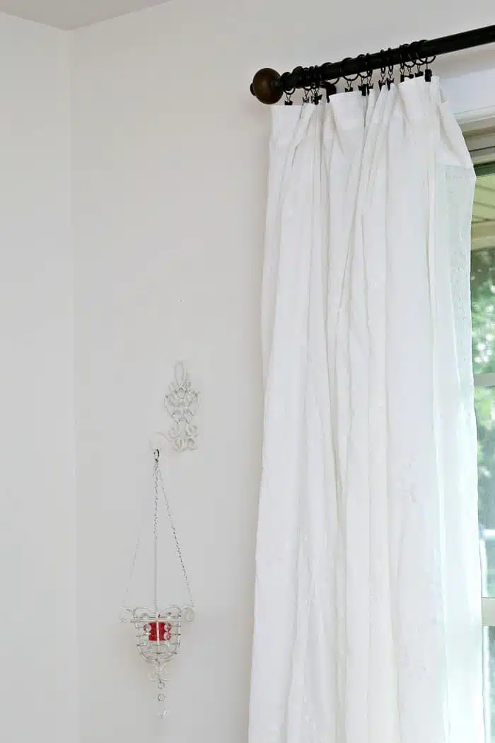 white curtains in the guest bedroom