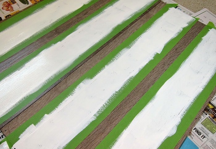 how to paint white stripes on a bookcase using FrogTape and white paint