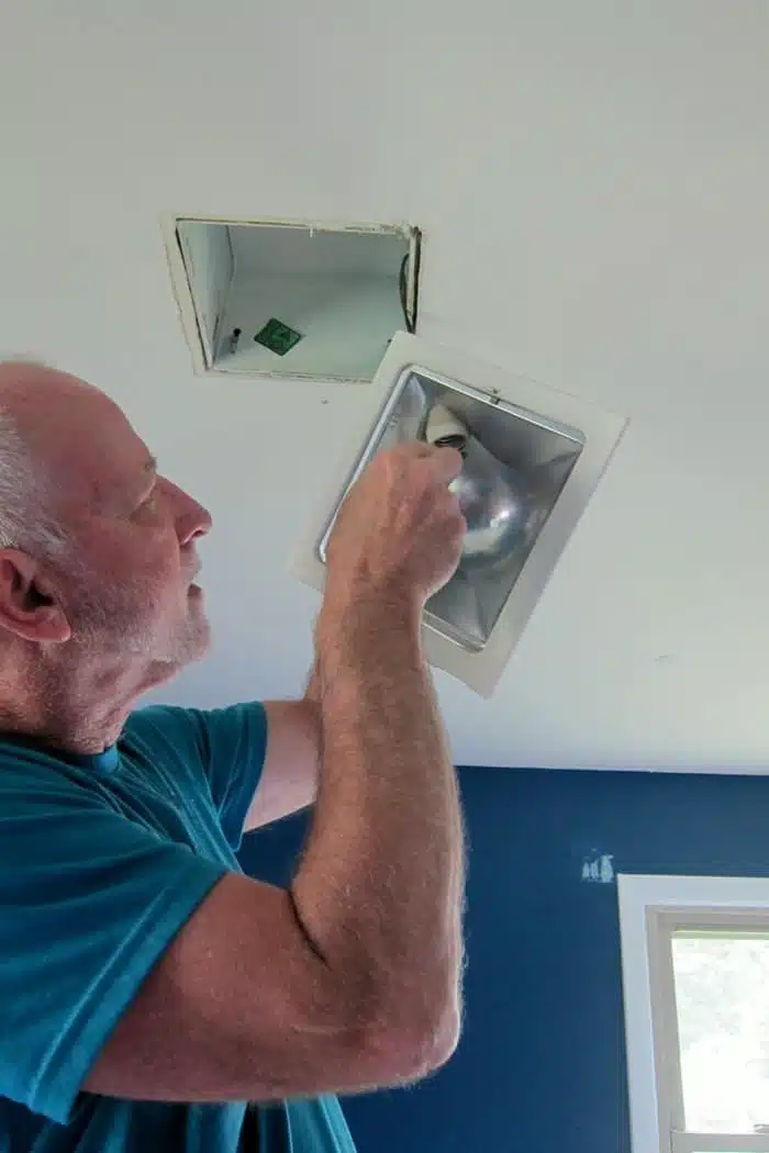 removing a ceiling light fixture to install a ceiling fan