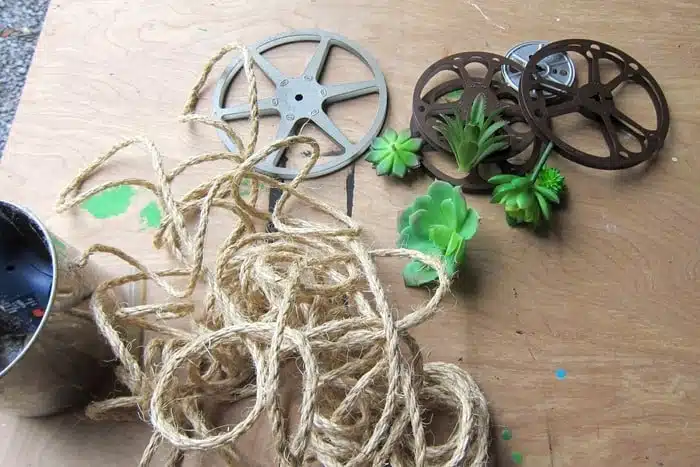 supplies for succulent wall display project with sisal rope and recycled 8mm movie reels