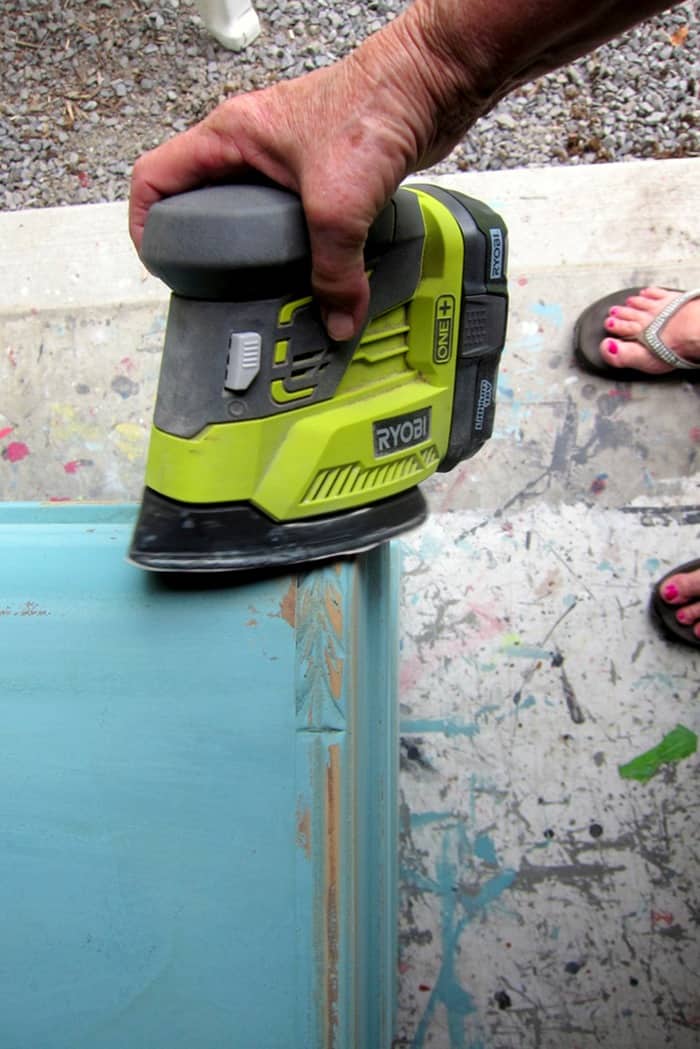 distressing painted furniture with a battery powered sander