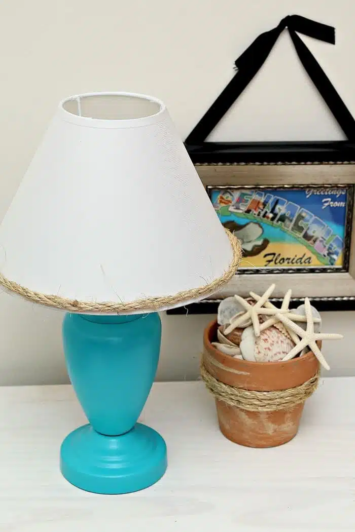 spray paint a lamp and decorate the shade with sisal rope