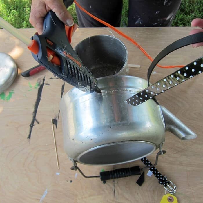 hot glue a belt to kitchen pots and make a planter
