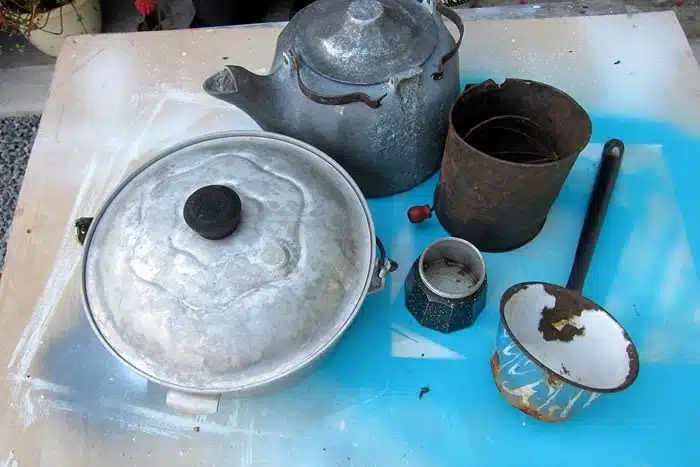 Thrift store pots and tea kettles make unique flower pots