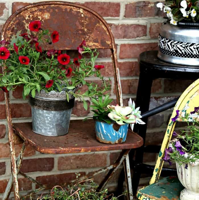 vintage tea kettles and water dippers make great flower pots