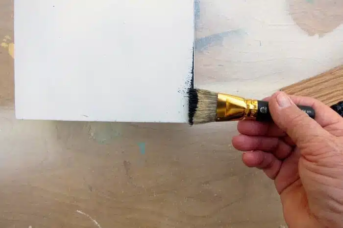 dry brush black paint around edges of white box