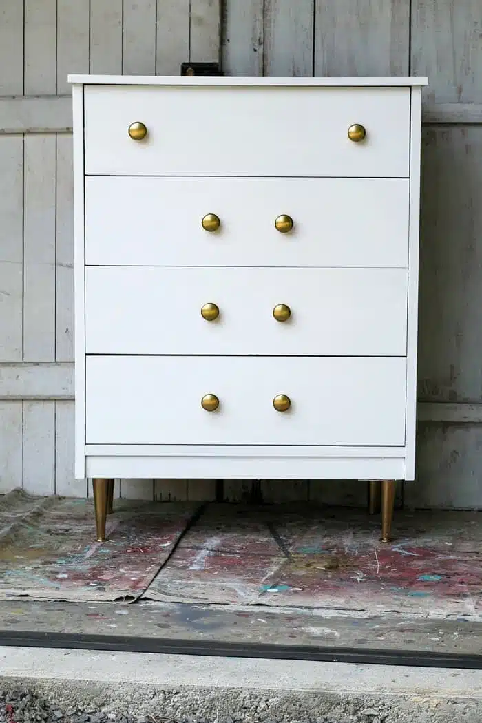 white furniture with gold knobs