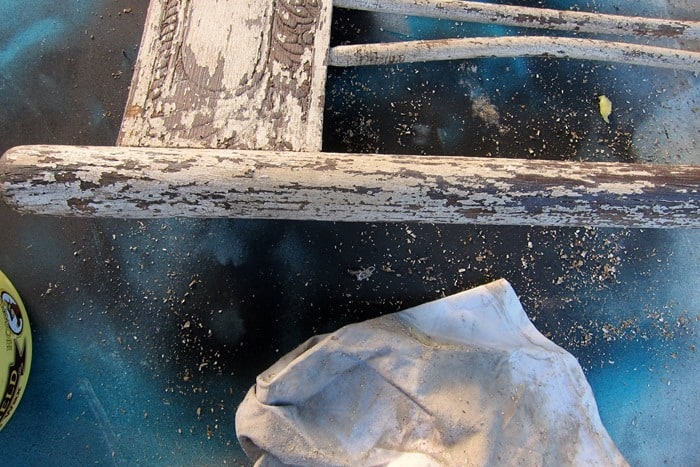 use a rag to apply wax to furniture