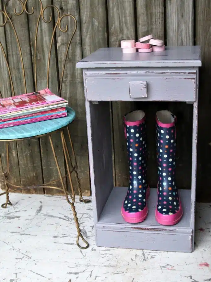 Gray and pink paint layered on a table 