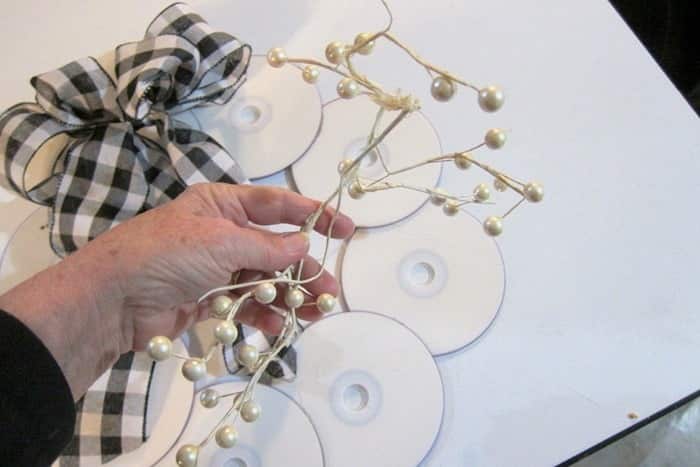 add decorative bead stems to a wreath bow