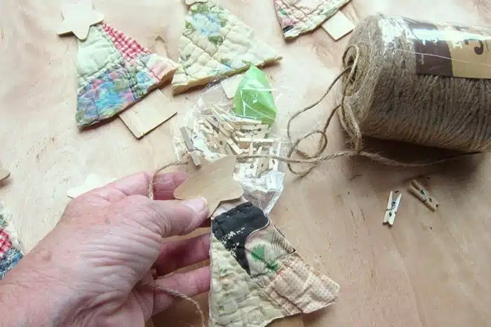 attach diy trees to twine using mini clothes piins