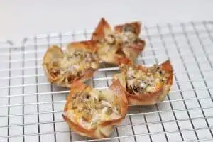 Baked wonton wrappers with Sausage and Ranch Dressing Mixture