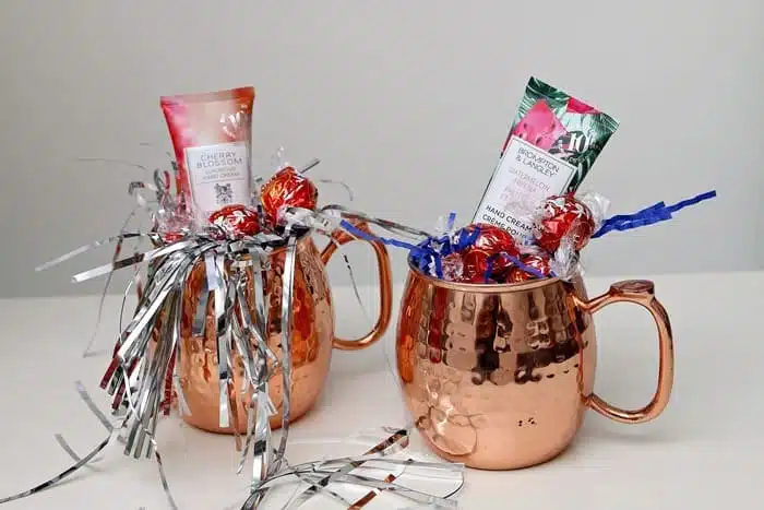 Copper mugs filled with gifts