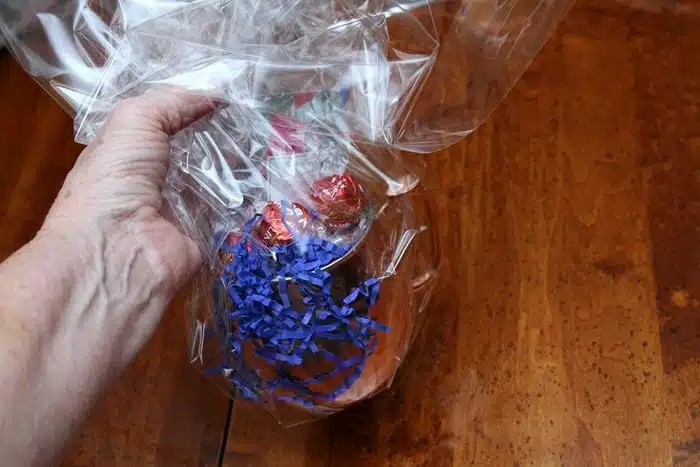 time to tie clear basket wrap around a copper mug