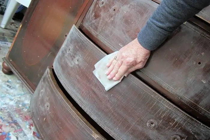 sanding furniture by hand