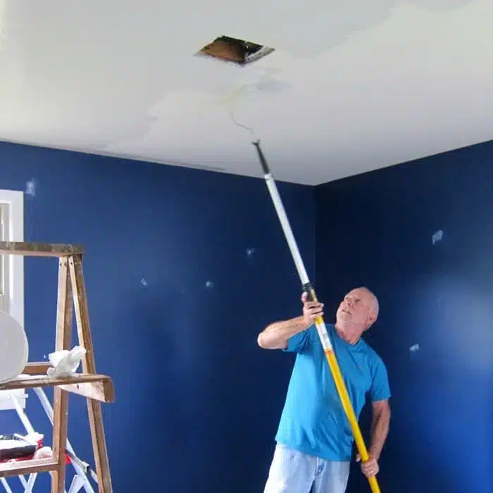 painting bedroom ceiling with paint stick