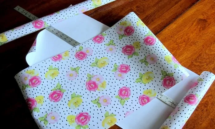 use wrapping paper to line furniture drawers