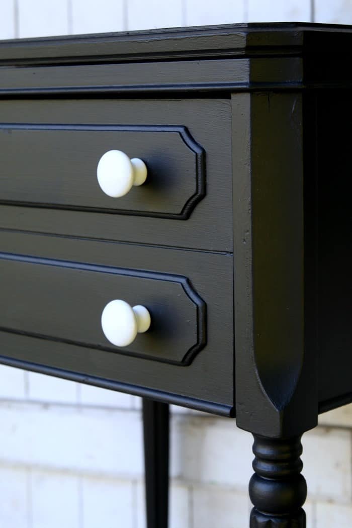 Remove the machine from the sewing machine cabinet and paint the cabinet to use as an end table