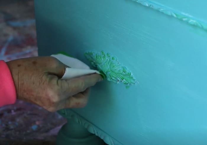 green color wash on turquoise paint